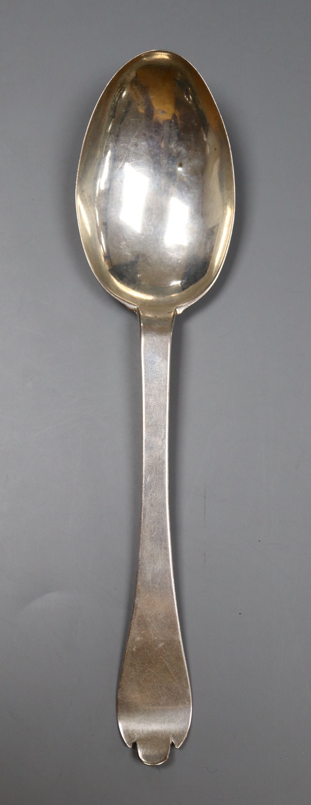 An 18th century Guernsey silver dog-nose spoon, makers mark only for Henry Guillaume, with engraved initials, 18.2cm, 27 grams.